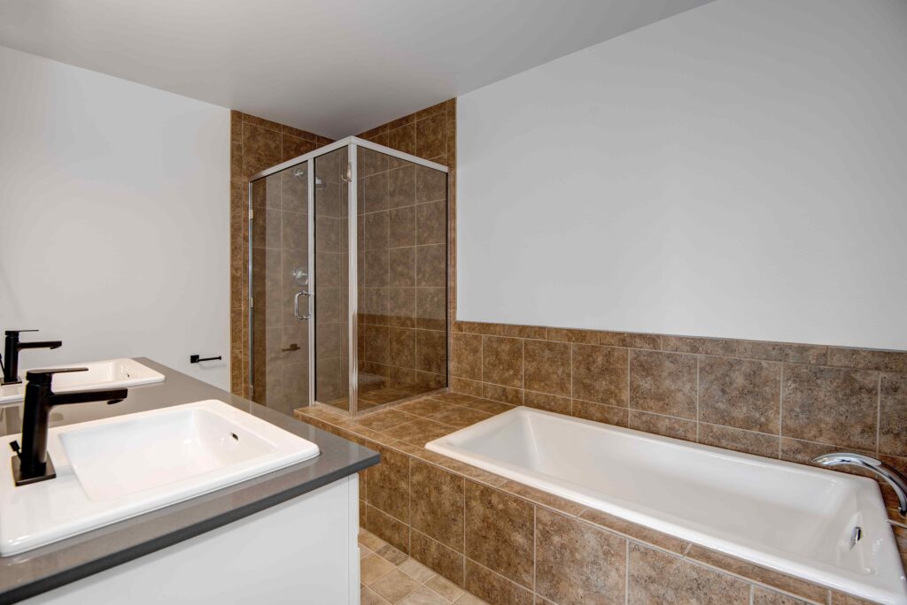 bathroom with a shower and bath tub